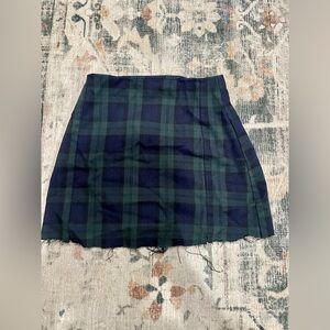 A preowned green, black and blue Brandy Melville skirt